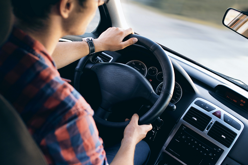 A person driving a car.