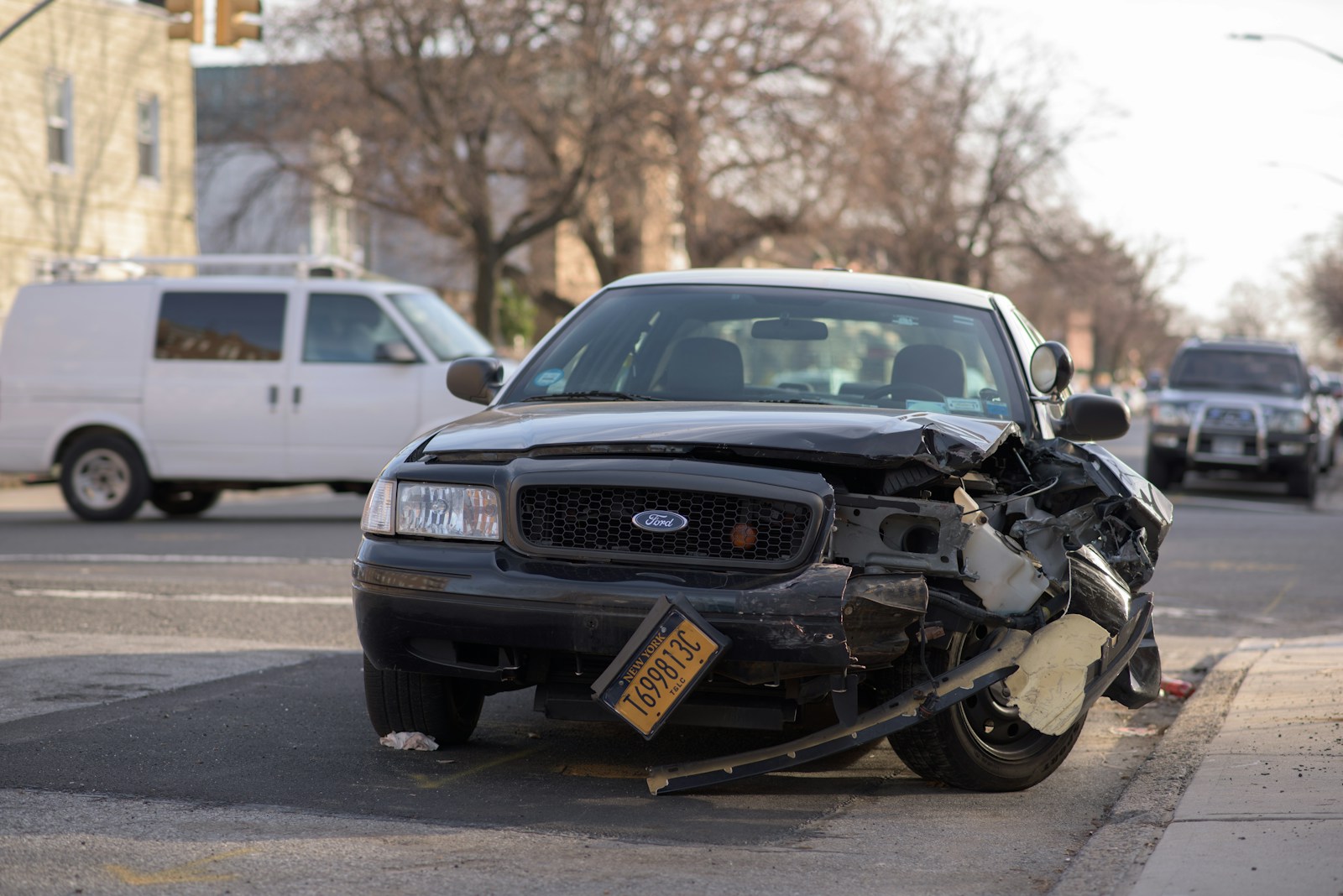 black Ford car with Comprehensive and Collision Insurance